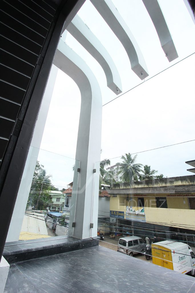 Curvy RCC Balcony Roof Pergola with Bended cum Tempered glass 